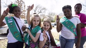 Four Girl Scouts and their chaperone