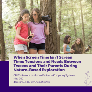 In the foreground two tweens use a cell phone to make nature observations. One is holding a pair of binoculars.