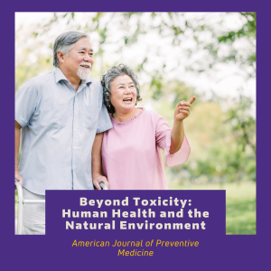 Two older adults walking in a park. One is using a mobility device.