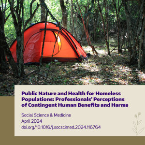 An orange tent in a forested park