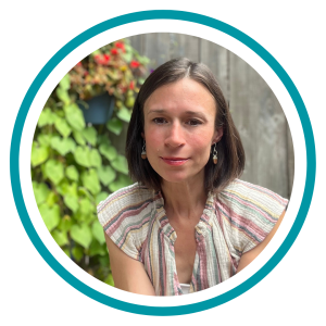 A headshot of Stacey Alfonso with plants in the background.