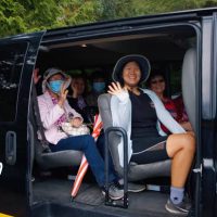 People vanpooling to a hiking site.