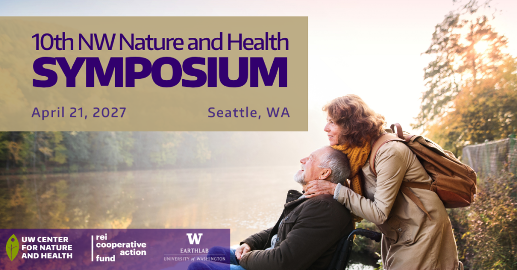 Two older adults in nature looking at a lake